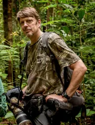 Tim Laman in the field with a telephoto lens